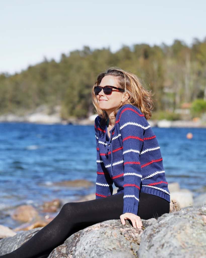 Women sitting on rocks in Stockholm Archipelago